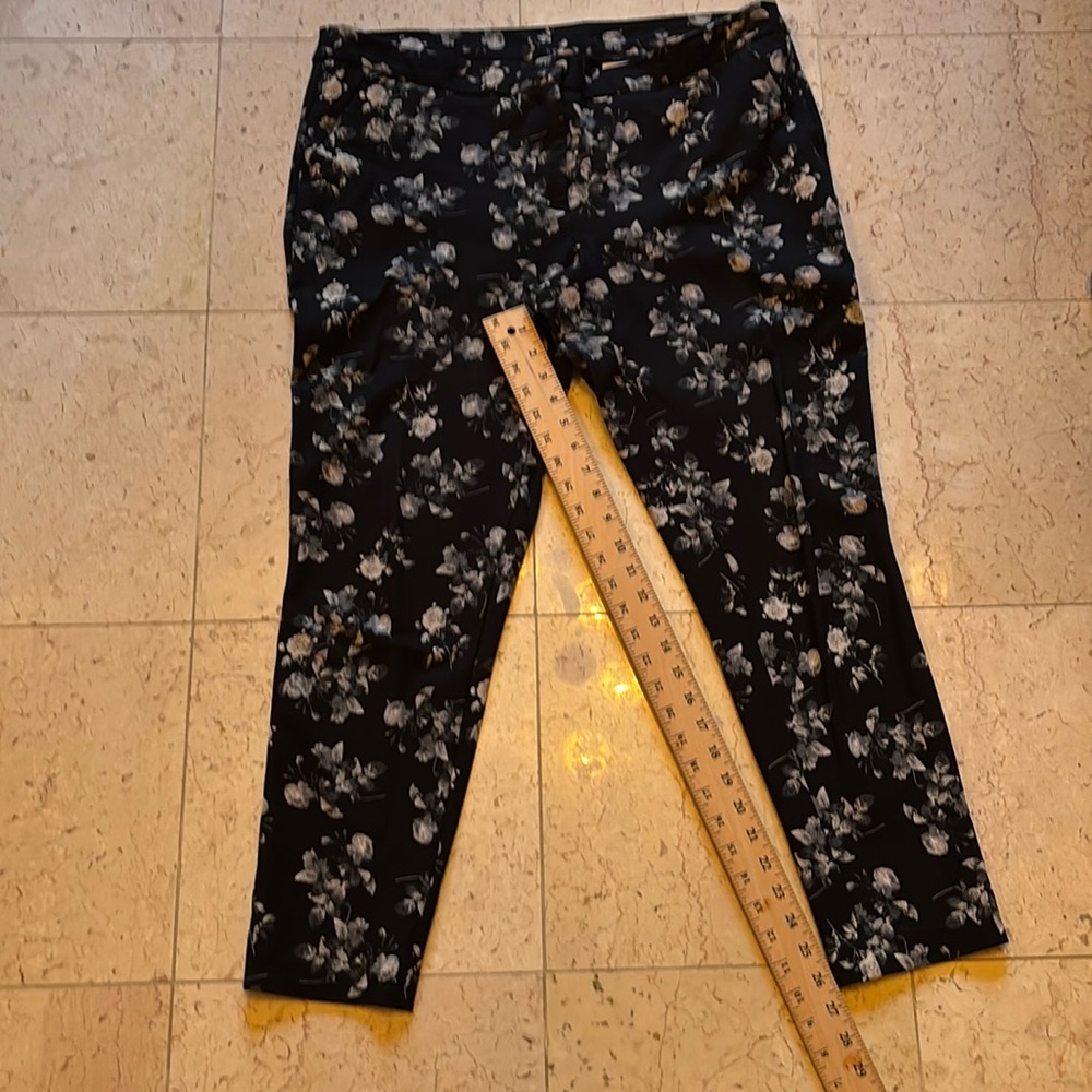 Black pants with white flowers. Size 16, two front zip pockets